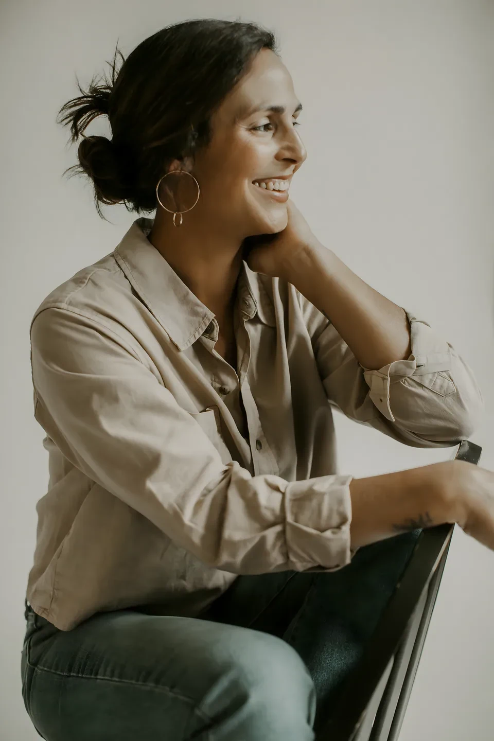Marisa Bello smiling in a natural light candid portrait